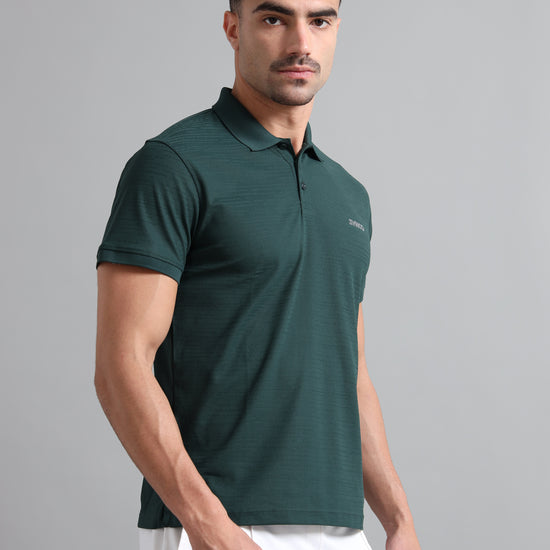  a man wear Synco zen green polo tshirt 